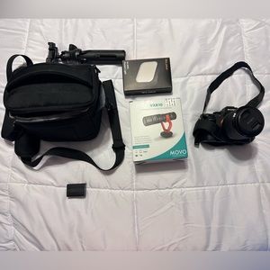 Sony A7 II with case, stand, flash, additional battery and microphone.